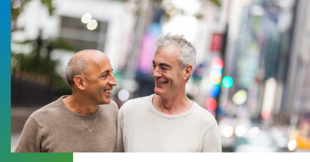 Two men walking in a city